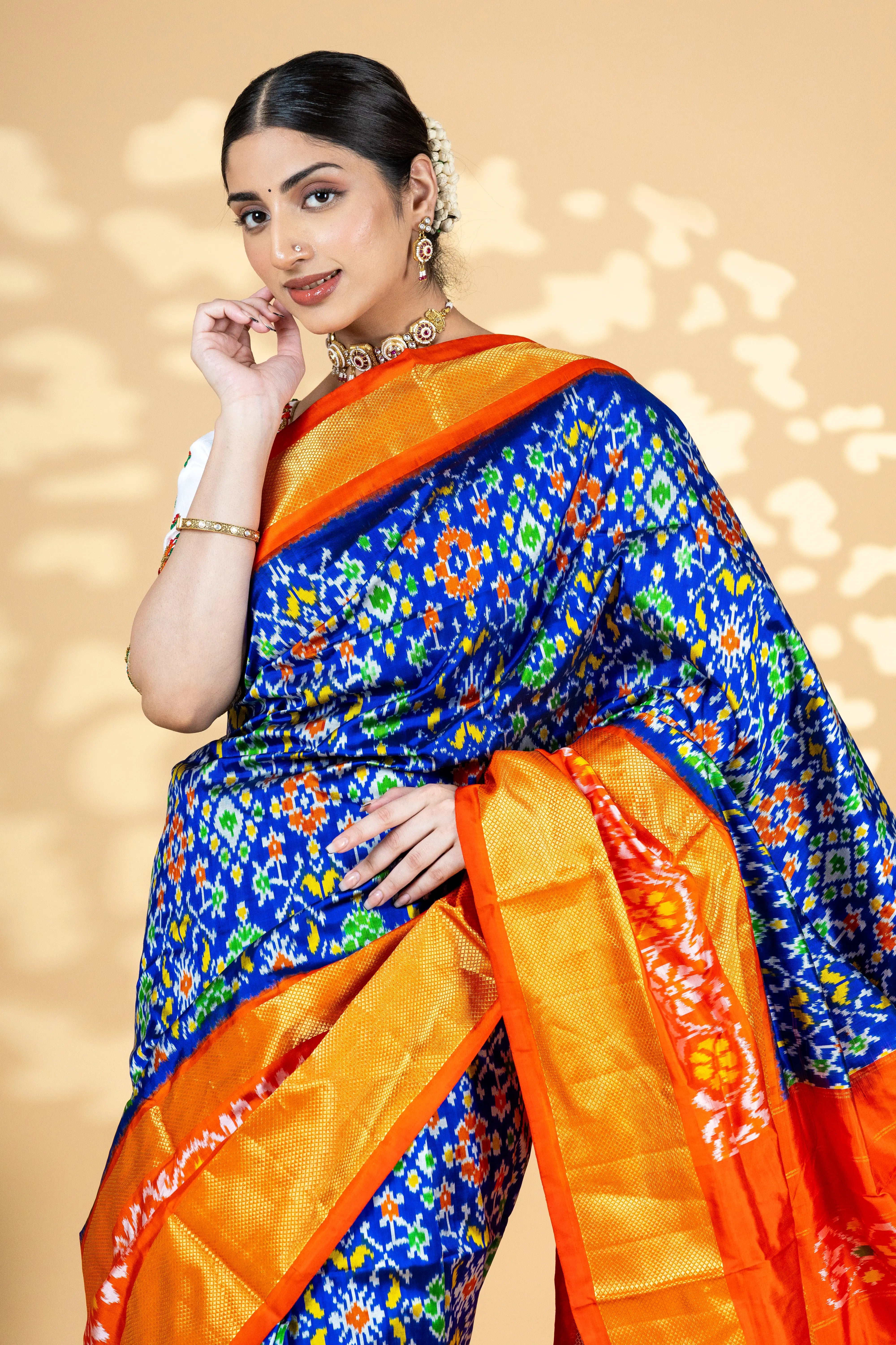 Blue Pochampally Silk Saree With Beautiful Ikaat Detailing And Bright Contrast Red Border