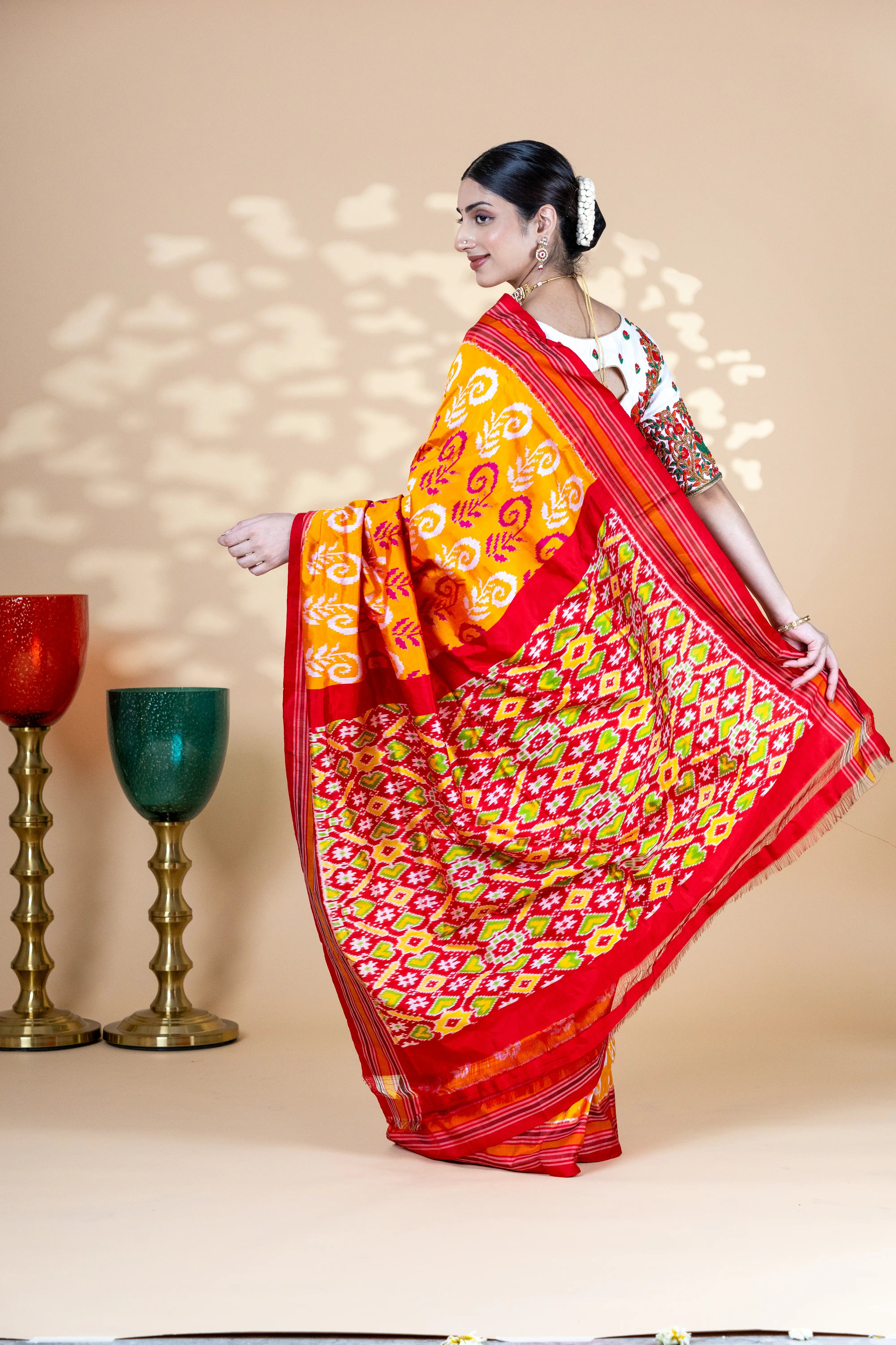 Orange Pochampally Silk Saree With Beautiful Ikaat Detailing And Red Border