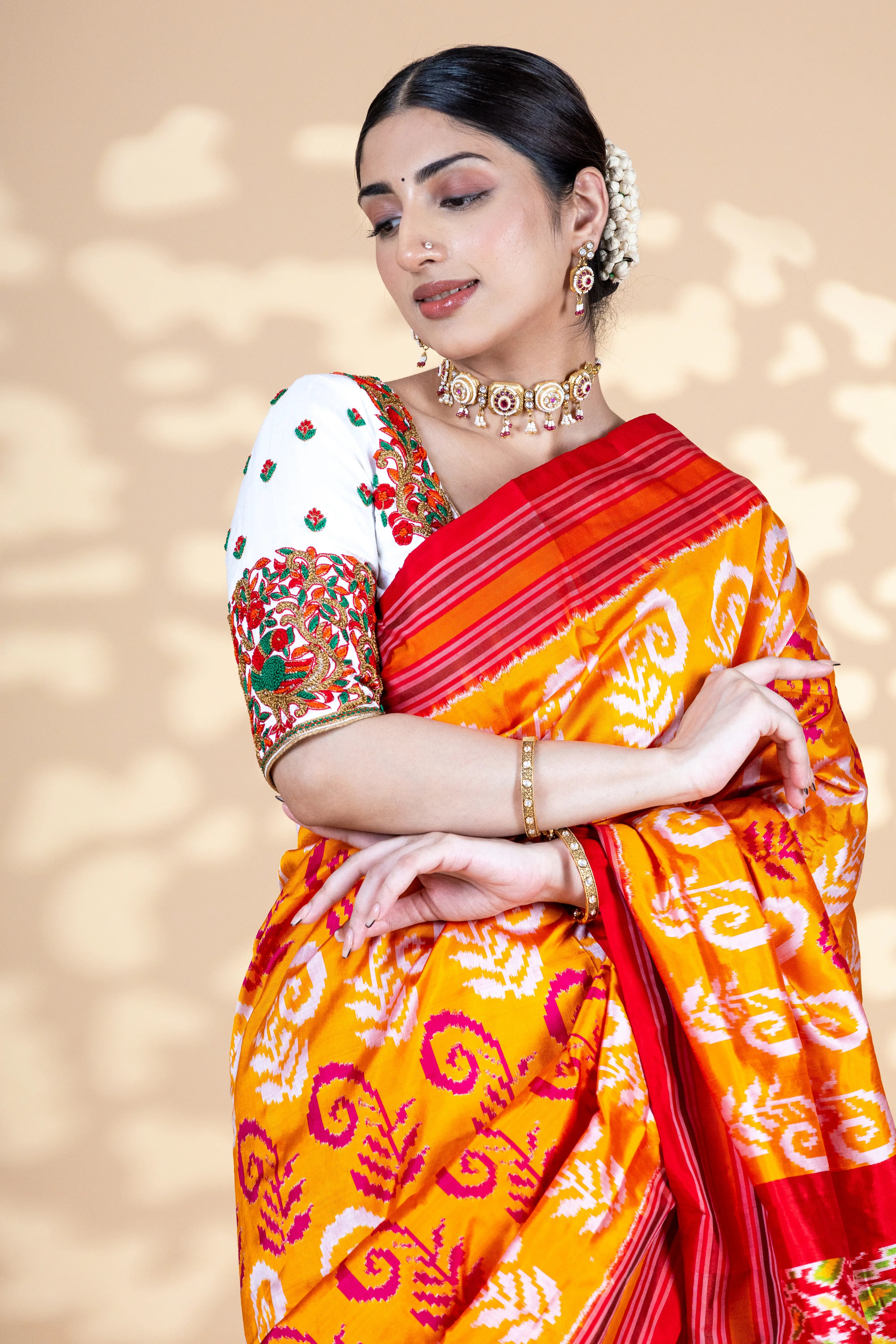 Orange Pochampally Silk Saree With Beautiful Ikaat Detailing And Red Border