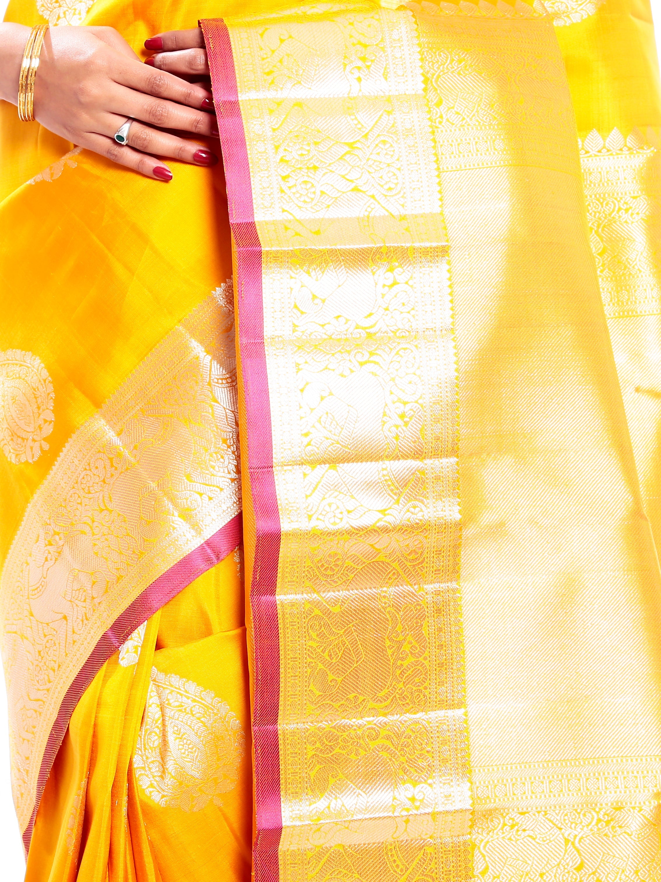 Kanchipuram Silk Saree in Yellow + Thilagam Motifs + Elegant Broad Border in Pure Zari with Yali Motifs