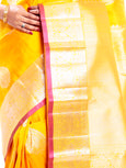 Kanchipuram Silk Saree in Yellow + Thilagam Motifs + Elegant Broad Border in Pure Zari with Yali Motifs